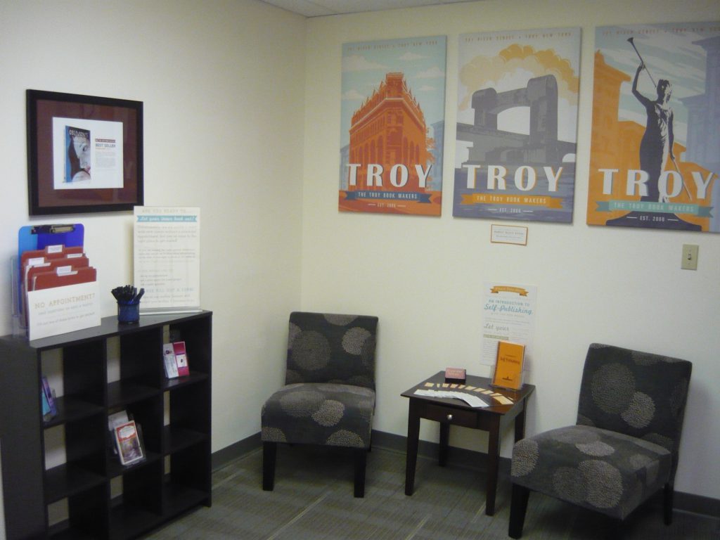 Our little lobby space, with Troy themed art by our staff.